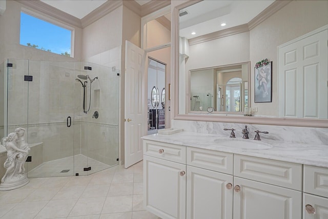 full bathroom featuring visible vents, vanity, ornamental molding, a shower stall, and tile patterned floors