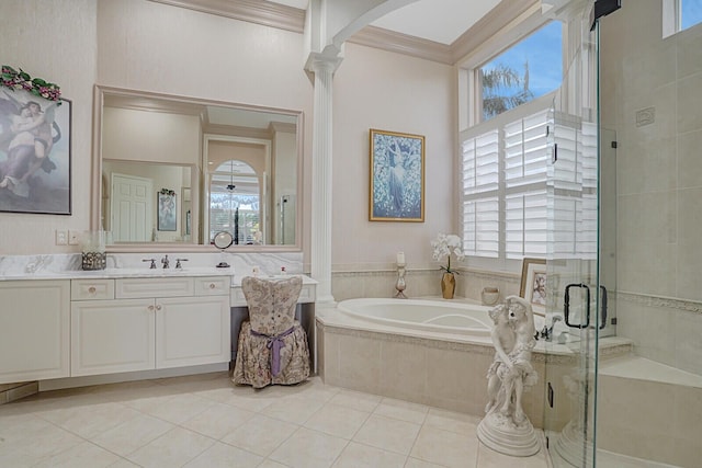 bathroom with a stall shower, plenty of natural light, crown molding, and ornate columns