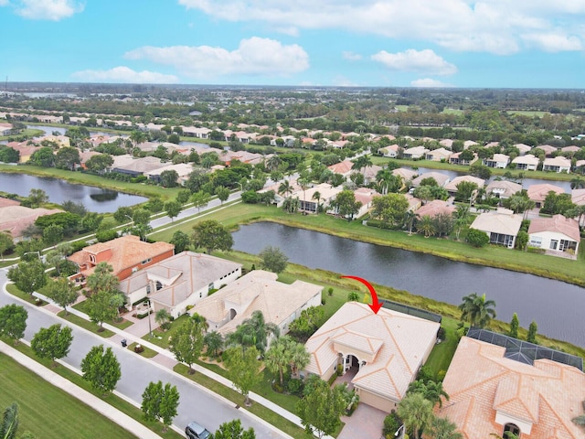 bird's eye view featuring a water view and a residential view