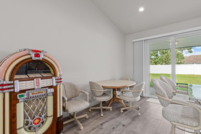 1825 SW Effland Ave, Port Saint Lucie, FL 34953 - dining room with vaulted ceiling, wood finished floors, recessed lighting, and baseboards