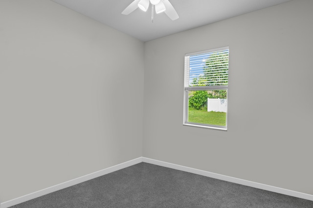 1825 SW Effland Ave, Port Saint Lucie, FL 34953 - empty room with dark colored carpet, baseboards, and ceiling fan