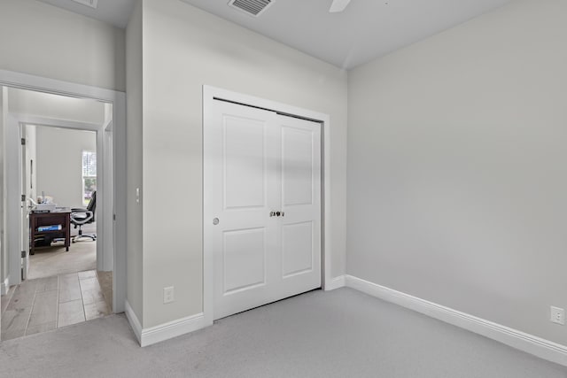 1825 SW Effland Ave, Port Saint Lucie, FL 34953 - unfurnished bedroom with an office area, baseboards, a closet, and ceiling fan