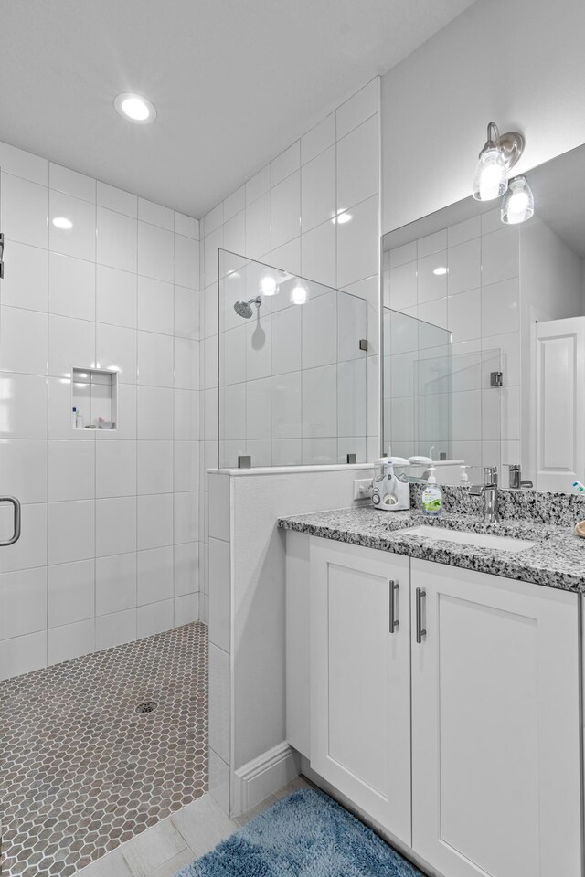 1825 SW Effland Ave, Port Saint Lucie, FL 34953 - full bathroom featuring a stall shower, vanity, tile patterned flooring, and recessed lighting
