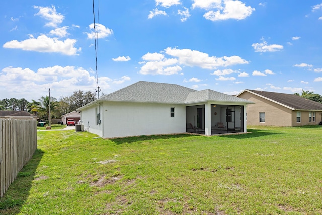 1825 SW Effland Ave, Port Saint Lucie, FL 34953 - rear view of property with a sunroom, central AC unit, stucco siding, and roof with shingles