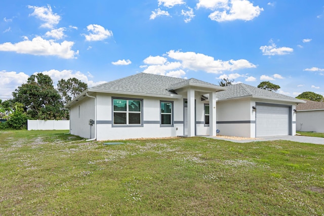 1825 SW Effland Ave, Port Saint Lucie, FL 34953 - view of front of property featuring an attached garage, driveway, stucco siding, and roof with shingles