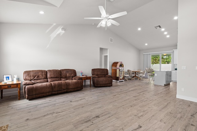 1825 SW Effland Ave, Port Saint Lucie, FL 34953 - living room with high vaulted ceiling, light wood-type flooring, ceiling fan, and recessed lighting