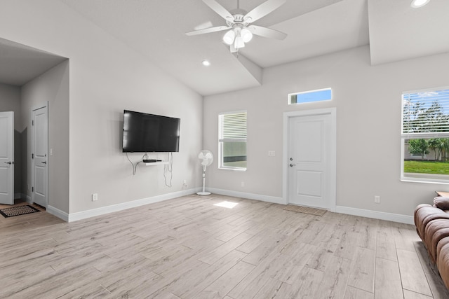 1825 SW Effland Ave, Port Saint Lucie, FL 34953 - unfurnished living room featuring ceiling fan, light wood-style flooring, recessed lighting, baseboards, and lofted ceiling