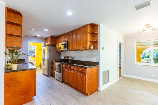 kitchen with open shelves, washer / clothes dryer, visible vents, backsplash, and appliances with stainless steel finishes