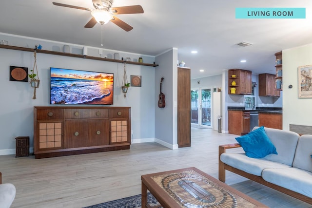 living area with baseboards, recessed lighting, visible vents, and light wood-style floors