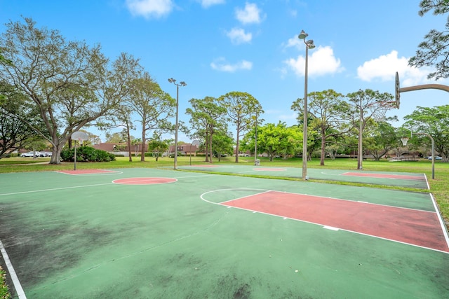 view of basketball court featuring community basketball court and a yard