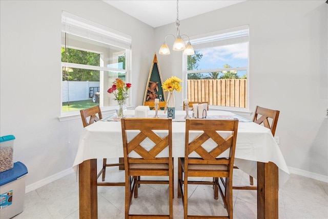 dining space with a chandelier