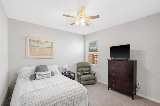 bedroom featuring ceiling fan and light colored carpet