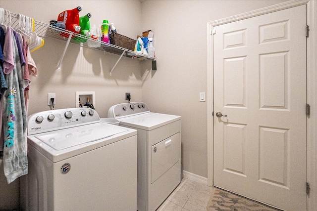 clothes washing area featuring independent washer and dryer