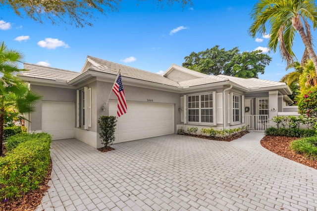 single story home with a garage