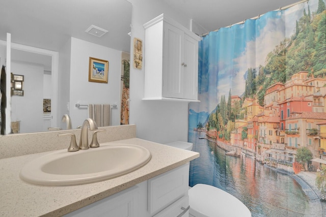 full bathroom with toilet, a water view, visible vents, and vanity