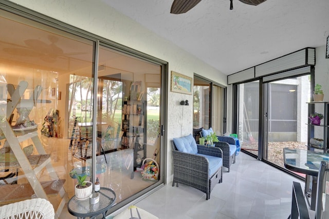 sunroom / solarium with ceiling fan