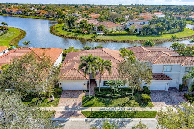 bird's eye view with a water view and a residential view