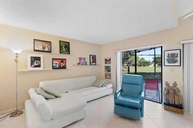 tiled living room featuring visible vents and a textured ceiling