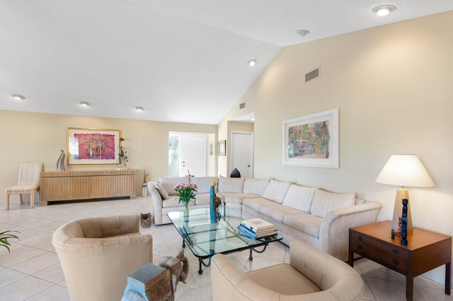 living room featuring high vaulted ceiling, visible vents, and light tile patterned flooring