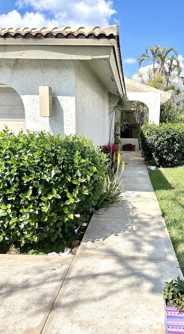 view of side of home featuring stucco siding