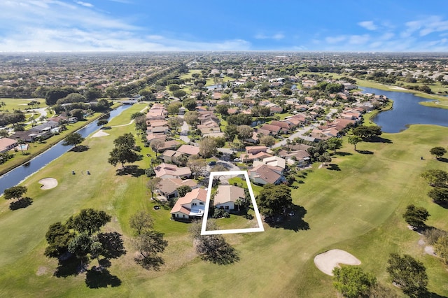 drone / aerial view with a residential view and a water view