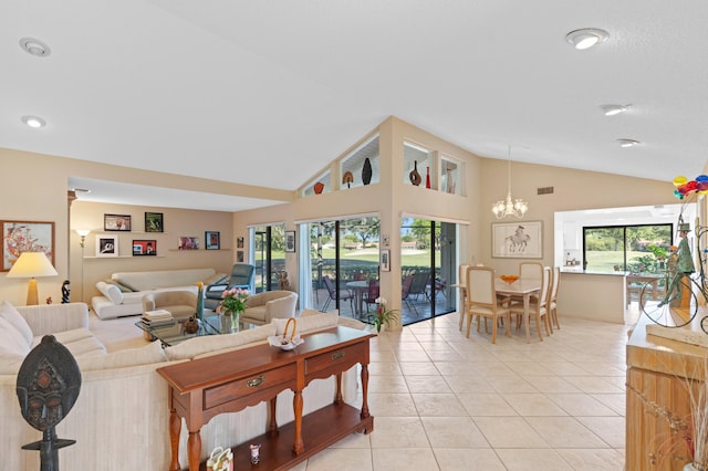 living room with high vaulted ceiling, light tile patterned floors, visible vents, and a notable chandelier