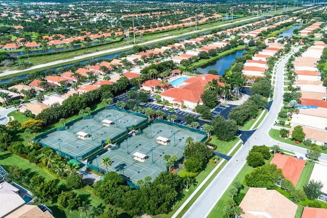 drone / aerial view with a residential view and a water view