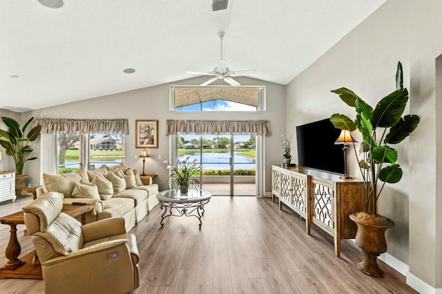 living room featuring baseboards, high vaulted ceiling, wood finished floors, and a ceiling fan