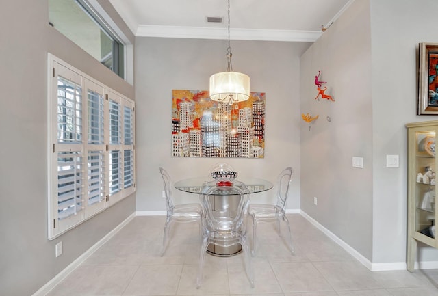 dining room with ornamental molding, visible vents, baseboards, and light tile patterned floors