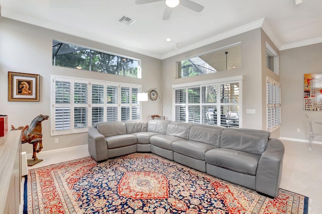 living room featuring ornamental molding, tile patterned flooring, visible vents, and baseboards