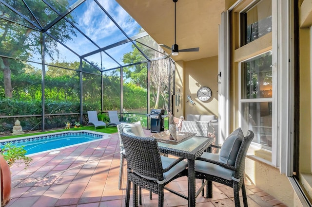 view of patio with area for grilling, a lanai, and an outdoor pool