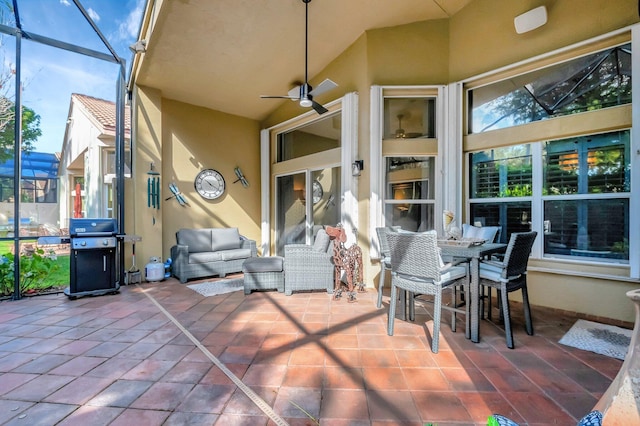 view of patio / terrace featuring outdoor lounge area, area for grilling, a lanai, and a ceiling fan