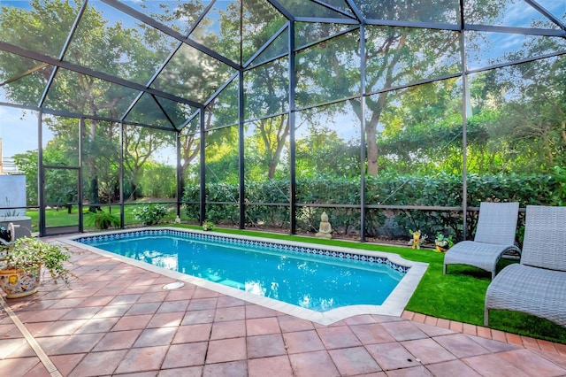 pool with a lanai and a patio area