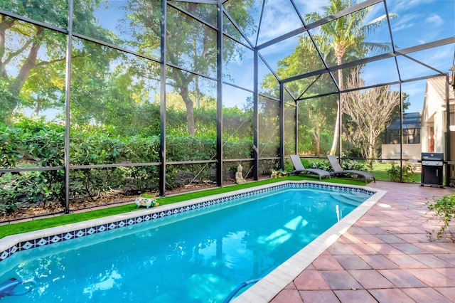 pool featuring a lanai, grilling area, and a patio