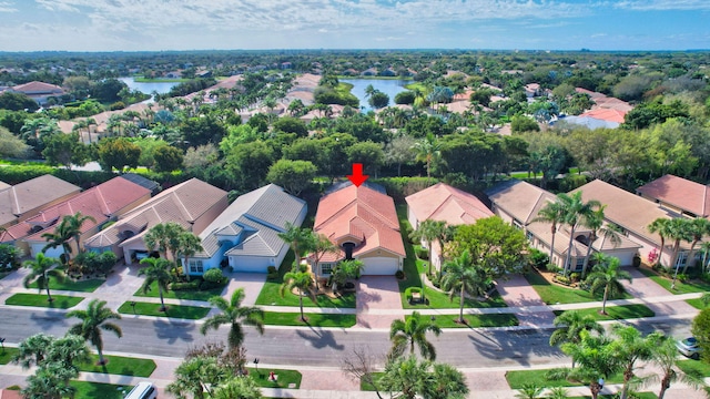 bird's eye view with a water view and a residential view