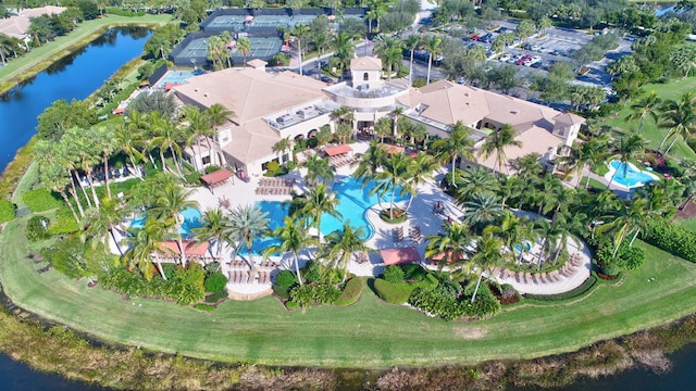 drone / aerial view with a water view and a residential view