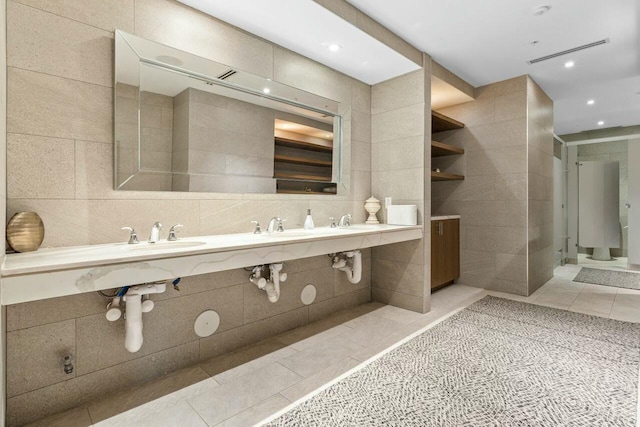 1180 N Federal Hwy Unit 1409, Fort Lauderdale, FL 33304 - bathroom featuring a sink, visible vents, recessed lighting, tile walls, and tile patterned floors