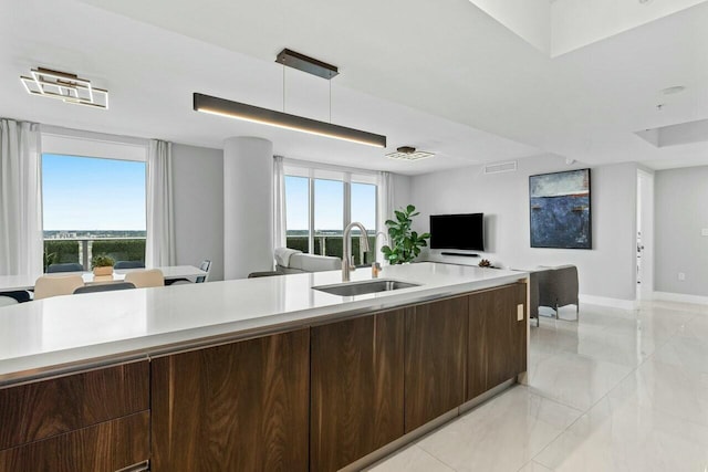 1180 N Federal Hwy Unit 1409, Fort Lauderdale, FL 33304 - kitchen with open floor plan, visible vents, light countertops, and a sink