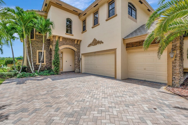 view of front of property with a garage