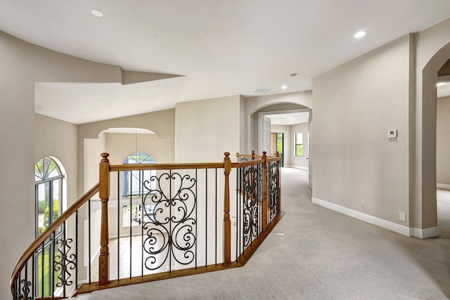 hallway with light carpet