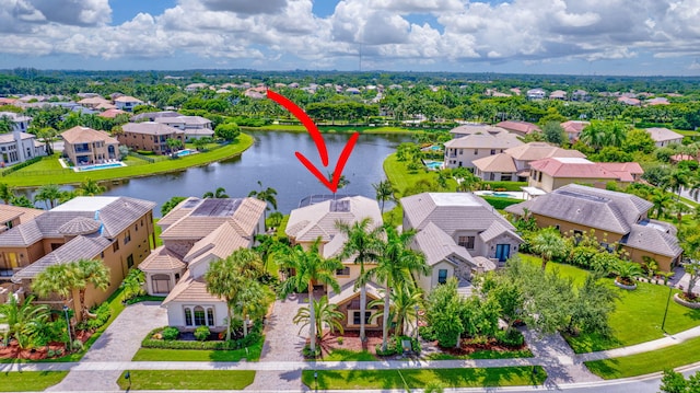 birds eye view of property featuring a water view