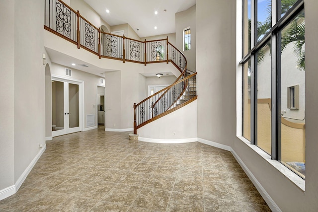 entryway with a high ceiling