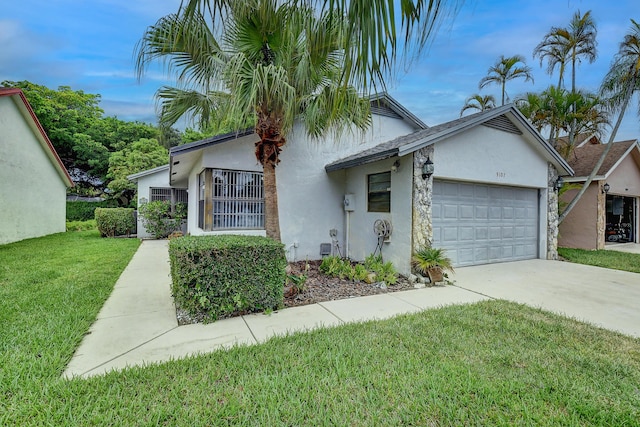 view of front of home featuring a front lawn, concrete driveway, an attached garage, and stucco siding