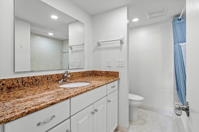 bathroom featuring recessed lighting, visible vents, vanity, and toilet