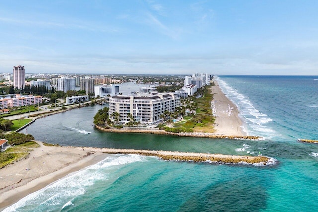 bird's eye view with a water view, a view of city, and a view of the beach