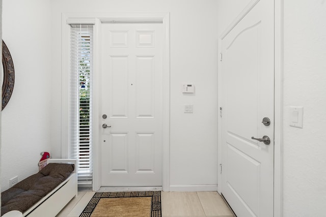 foyer with light tile patterned flooring