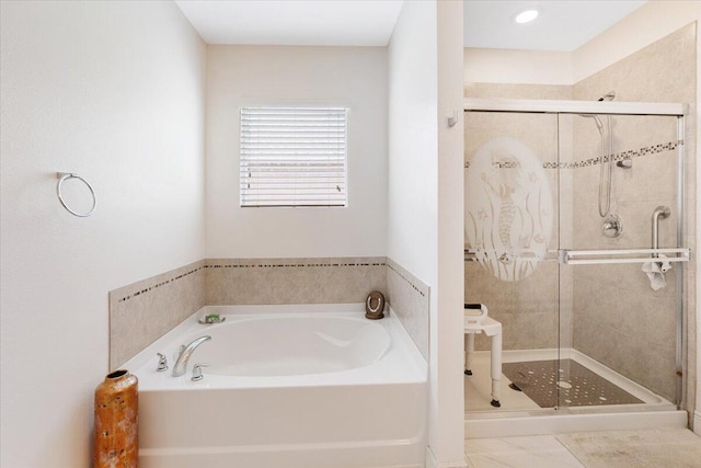 full bathroom with a garden tub and a shower stall