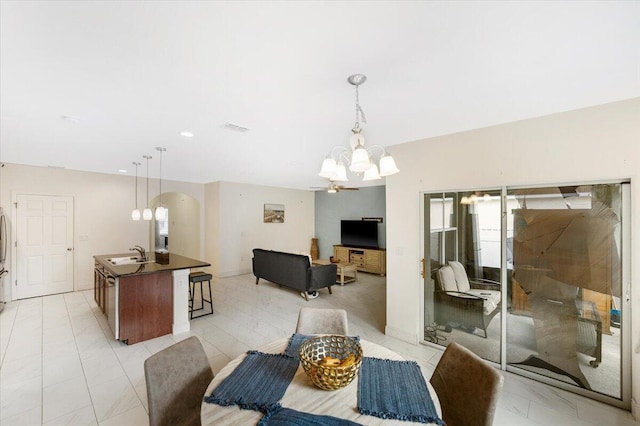 dining area with a chandelier, recessed lighting, visible vents, and baseboards