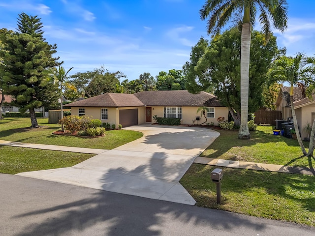 ranch-style home featuring a front yard and a garage