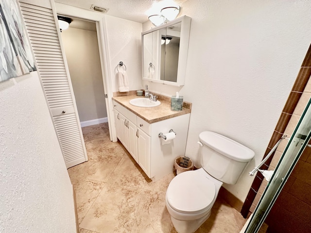 full bath with a closet, visible vents, toilet, vanity, and baseboards